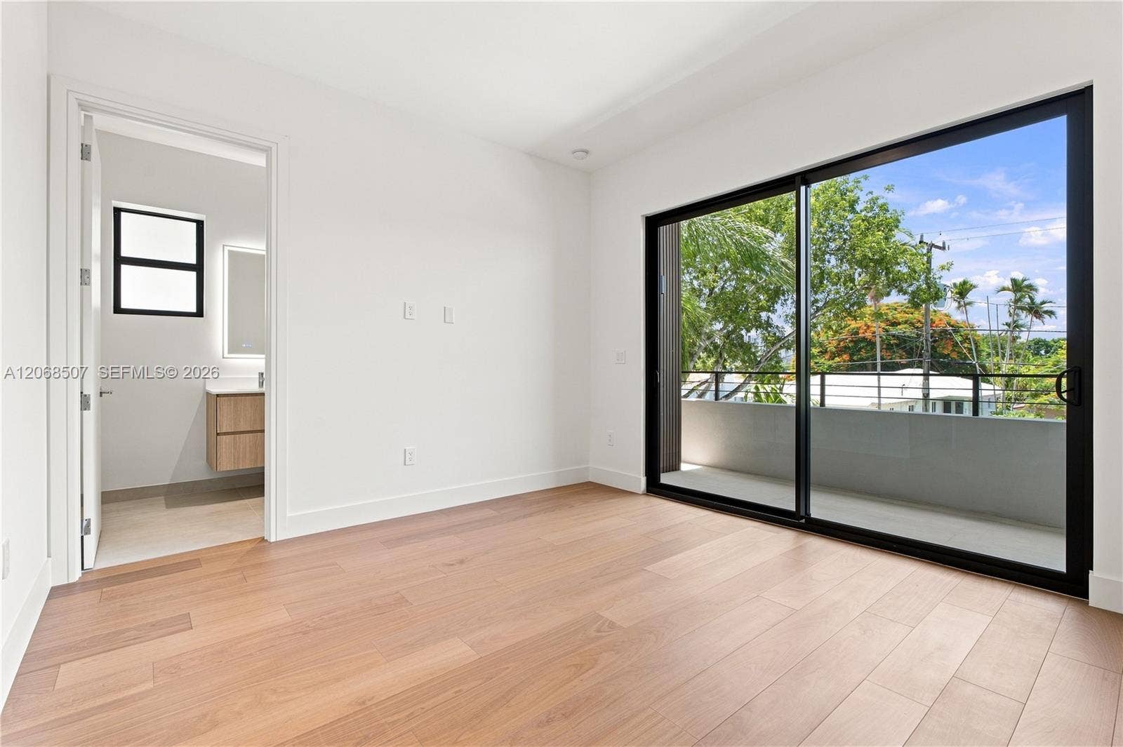 bedroom facing West with private balcony
