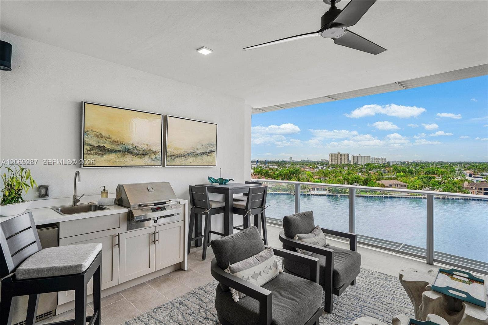 435 Bayshore Drive, #703, Fort Lauderdale, FL 33304 Expansive private terrace designed for outdoor living and entertaining, complete with a built-in gas grill.