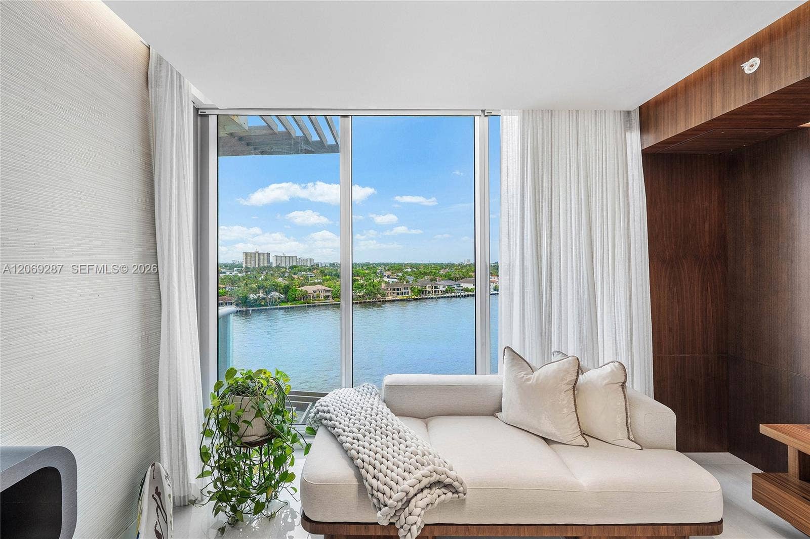 435 Bayshore Drive, #703, Fort Lauderdale, FL 33304 A private sitting area within the primary suite, perfectly positioned to enjoy the serene waterfront views.