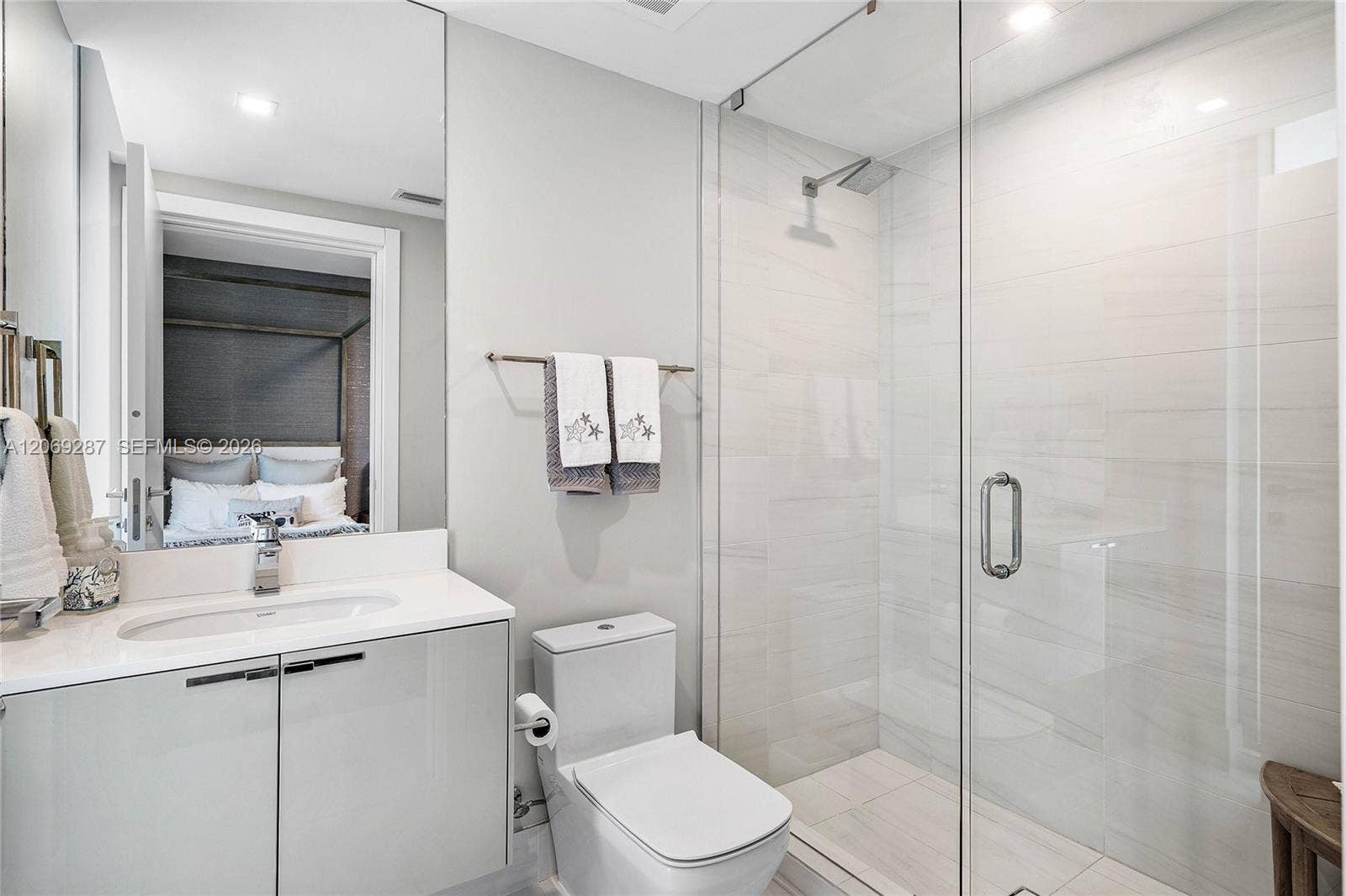 435 Bayshore Drive, #703, Fort Lauderdale, FL 33304 A well-appointed third bedroom with a private en-suite bathroom, providing comfort and privacy