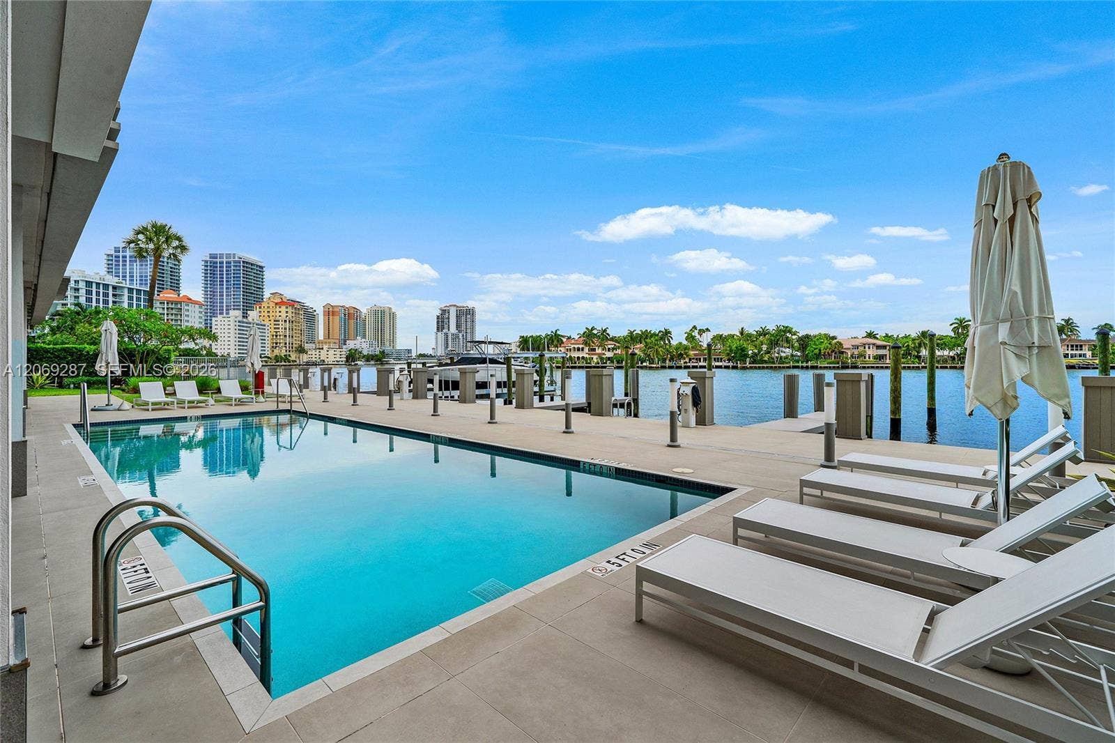 435 Bayshore Drive, #703, Fort Lauderdale, FL 33304 A covered poolside lounge provides a comfortable, shaded setting for relaxing and entertaining along the Intracoastal.