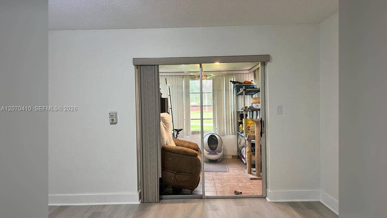 Primary Bedroom, Sliding Glass Door to Enclosed Porch