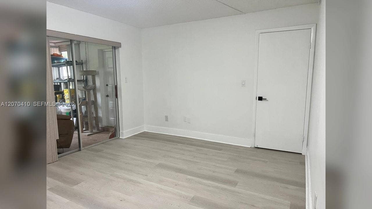 Primary Bedroom, Sliding Glass Door to Enclosed Porch