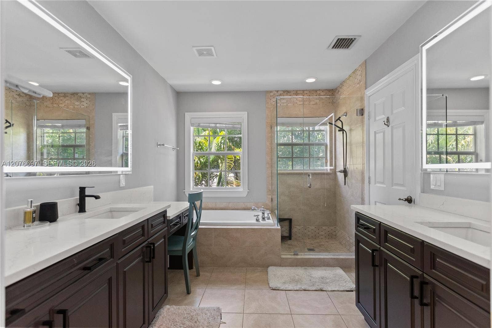 1139 N Victoria Park Road, Fort Lauderdale, FL 33304 Dual Sinks with large vanity and counters. Lighted Mirrors over each sink.