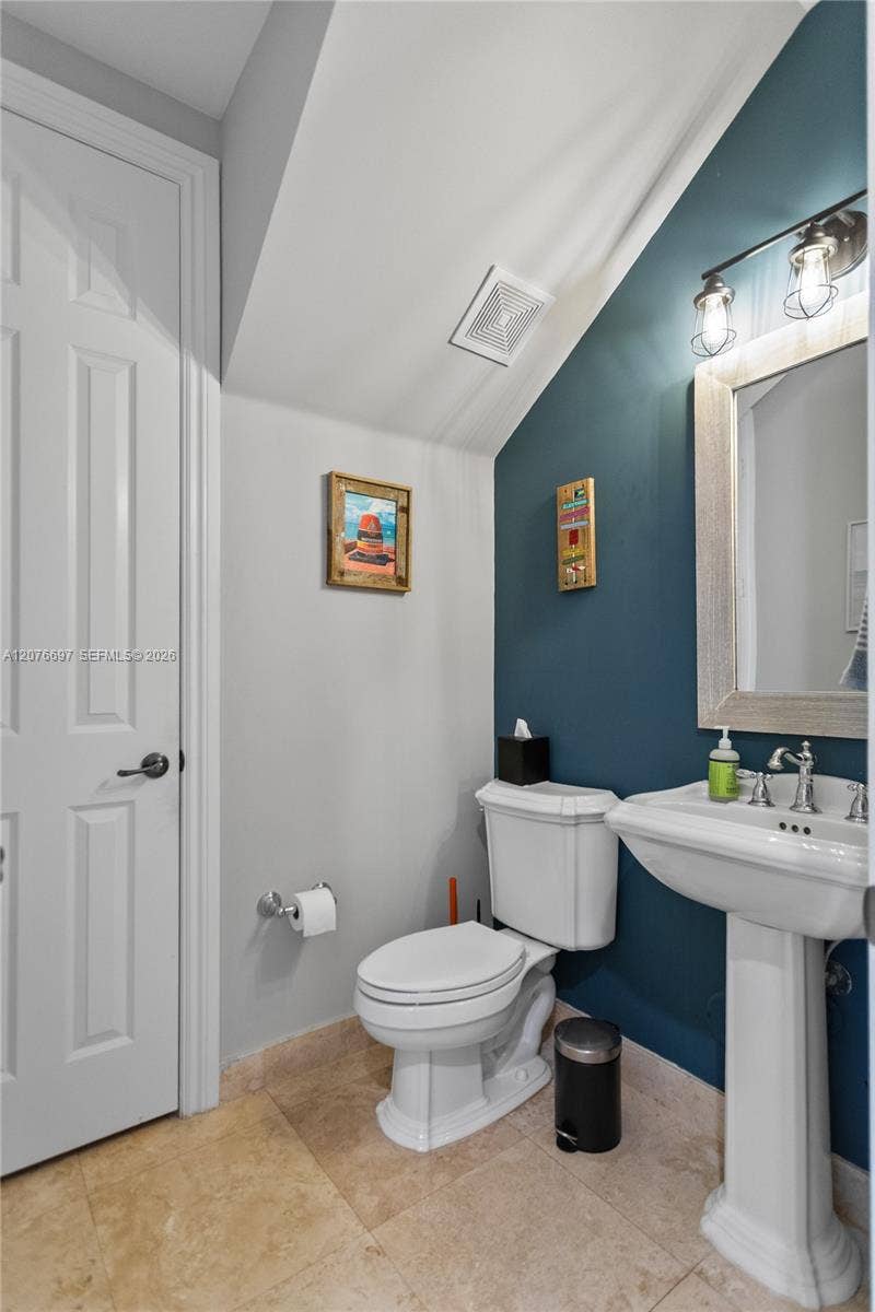 1139 N Victoria Park Road, Fort Lauderdale, FL 33304 1st Floor 1/2 Bath and Under Stair Storage Closet.