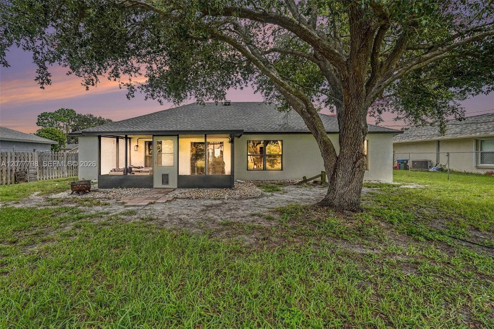 534 Davidson Street SE, Palm Bay, FL 32909 Twilight back yard and porch