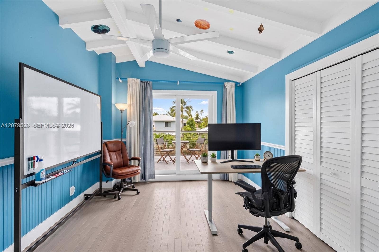 2518 Tortugas Lane, Fort Lauderdale, FL 33312 Guest bedroom w/ large private balcony w/ beamed ceiling overlooks pool area