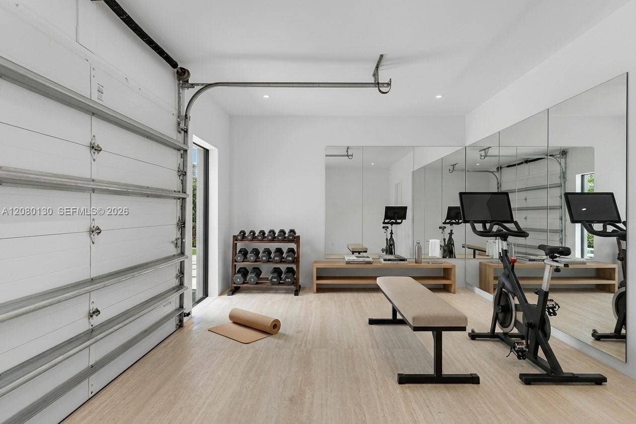 Garage/Gym. Disclaimer: Several photographs presented in this listing contain digitally added furniture, artwork, and decor. These virtually staged images are intended solely for illustrative purposes.