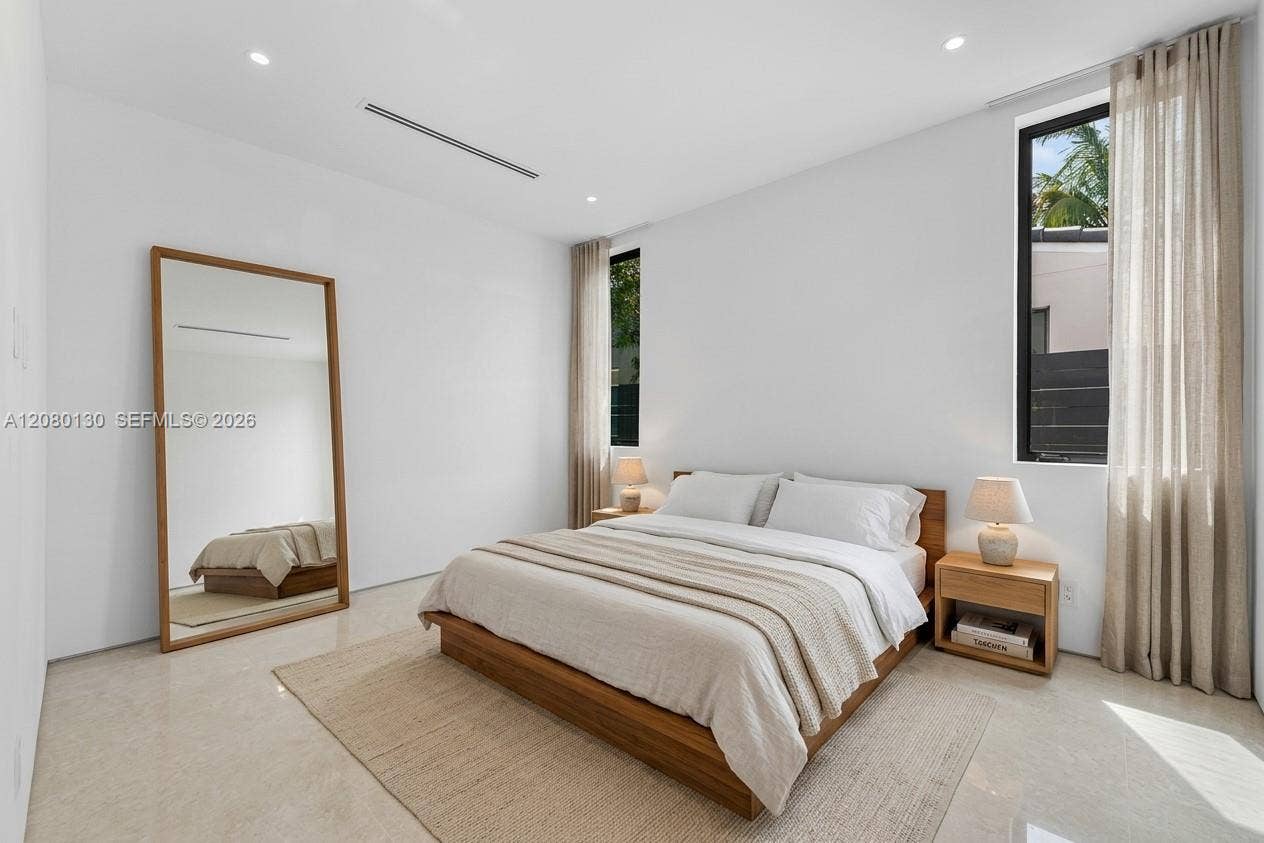 Guest Bedroom. Disclaimer: Several photographs presented in this listing contain digitally added furniture, artwork, and decor. These virtually staged images are intended solely for illustrative purposes.