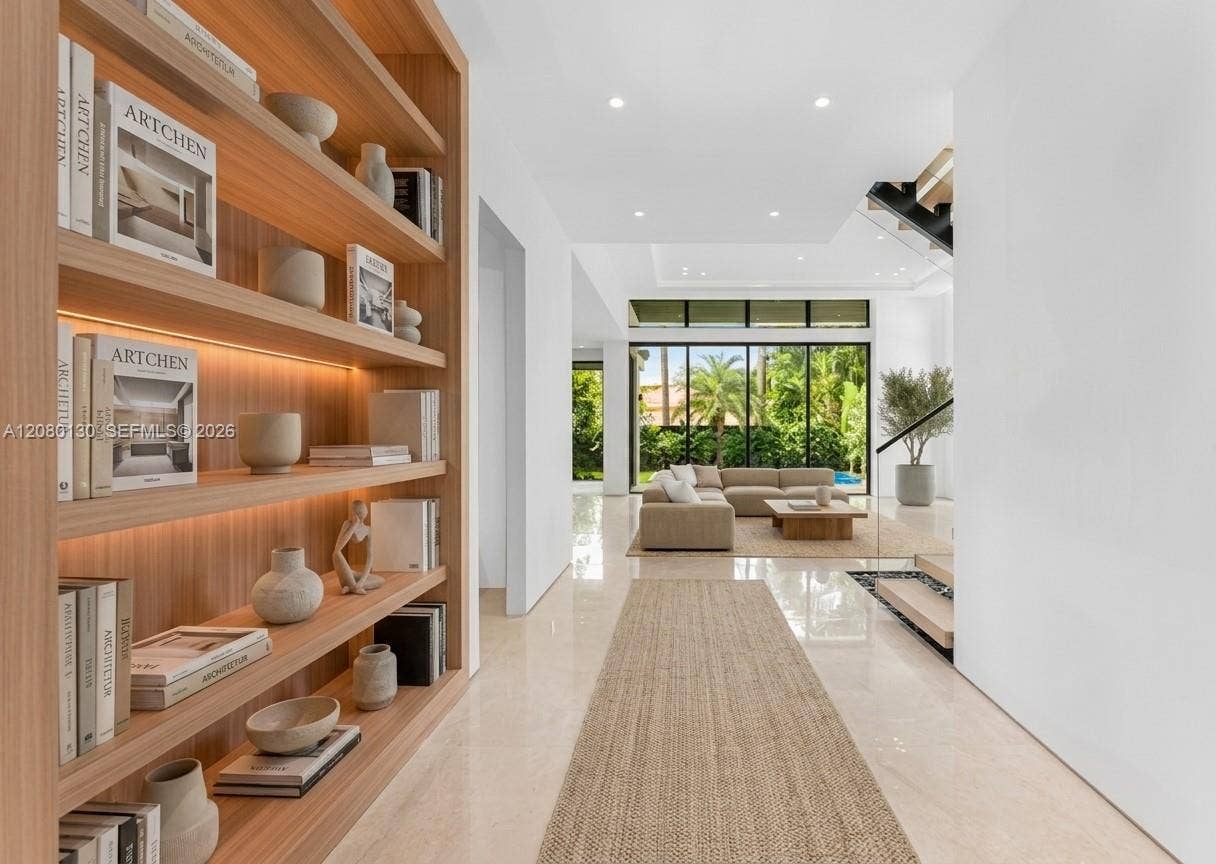 Entry. Disclaimer: Several photographs presented in this listing contain digitally added furniture, artwork, and decor. These virtually staged images are intended solely for illustrative purposes.