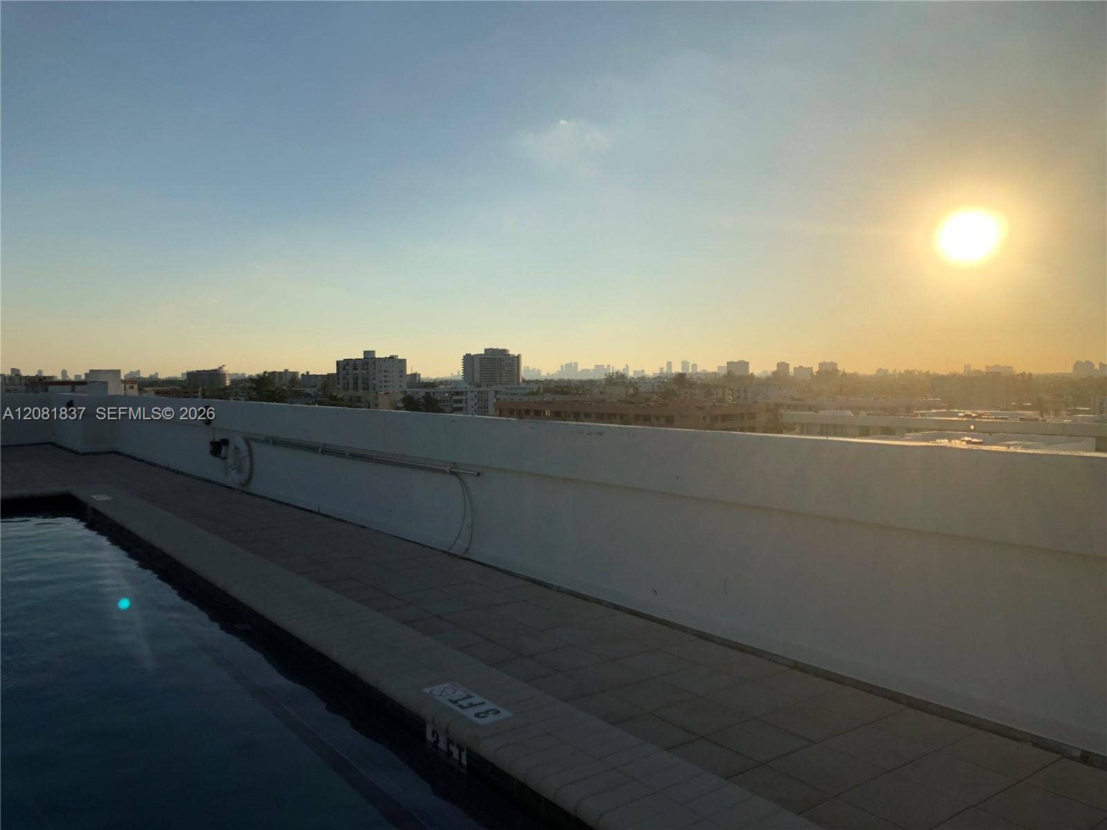 8233 Harding Avenue, #707, Miami Beach, Miami Beach, FL 33141 Rooftop swimming pool featuring tiled decking and a parapet wall