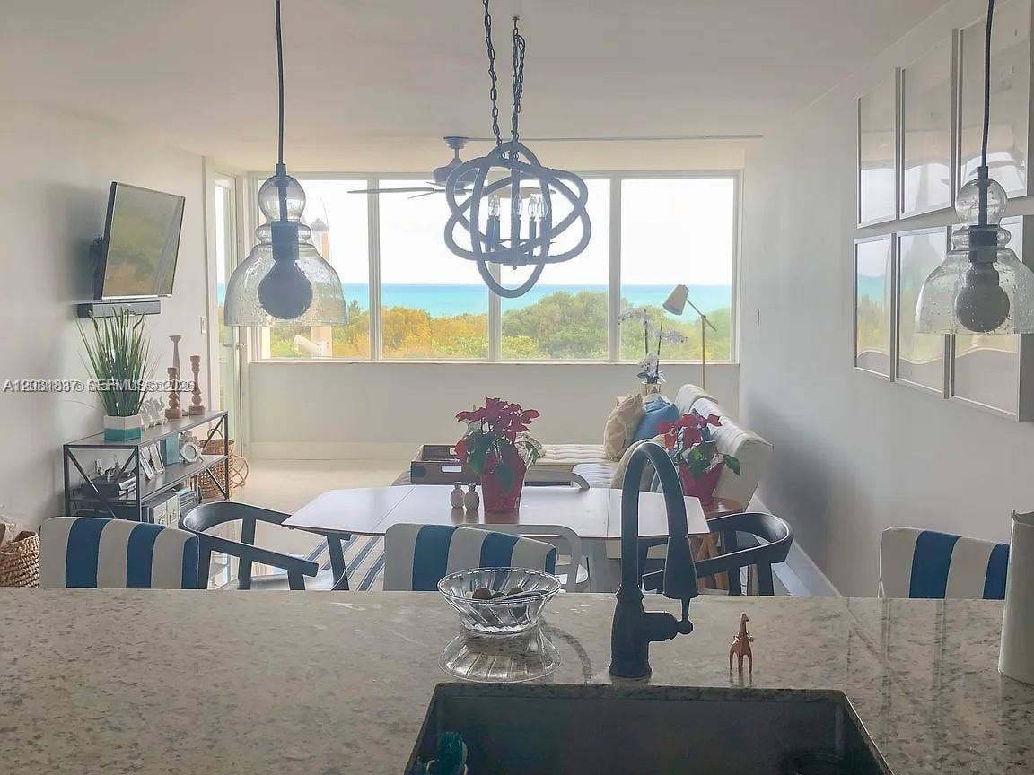 8233 Harding Avenue, #707, Miami Beach, Miami Beach, FL 33141 Bright, light-filled dining area anchored by expansive windows framing scenic landscape vistas