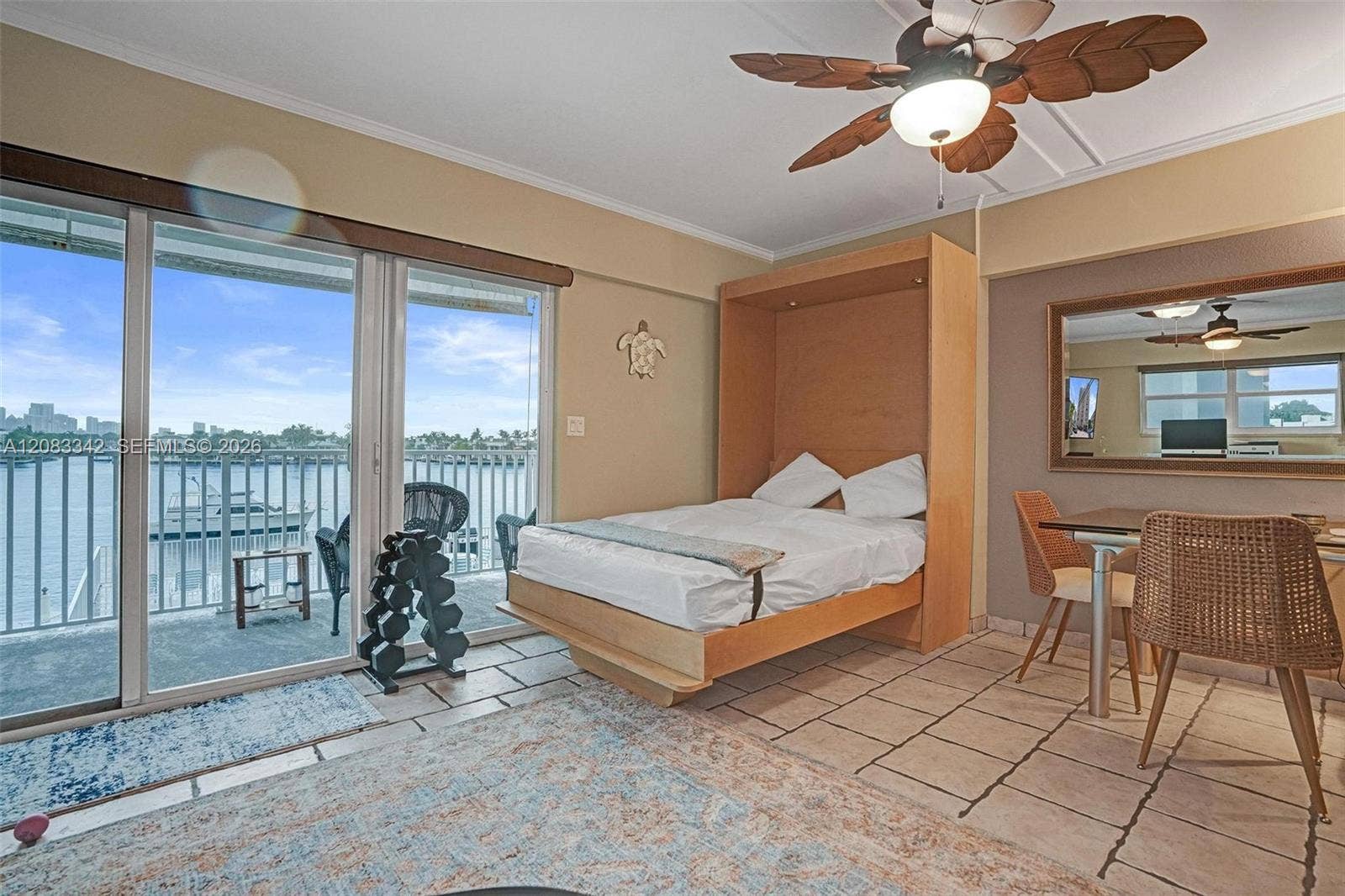95 N Birch Road, #301, Fort Lauderdale, Fort Lauderdale, FL 33304 Living Room has convenient Murphy Bed for overnight guests (looks as if it has never been used)