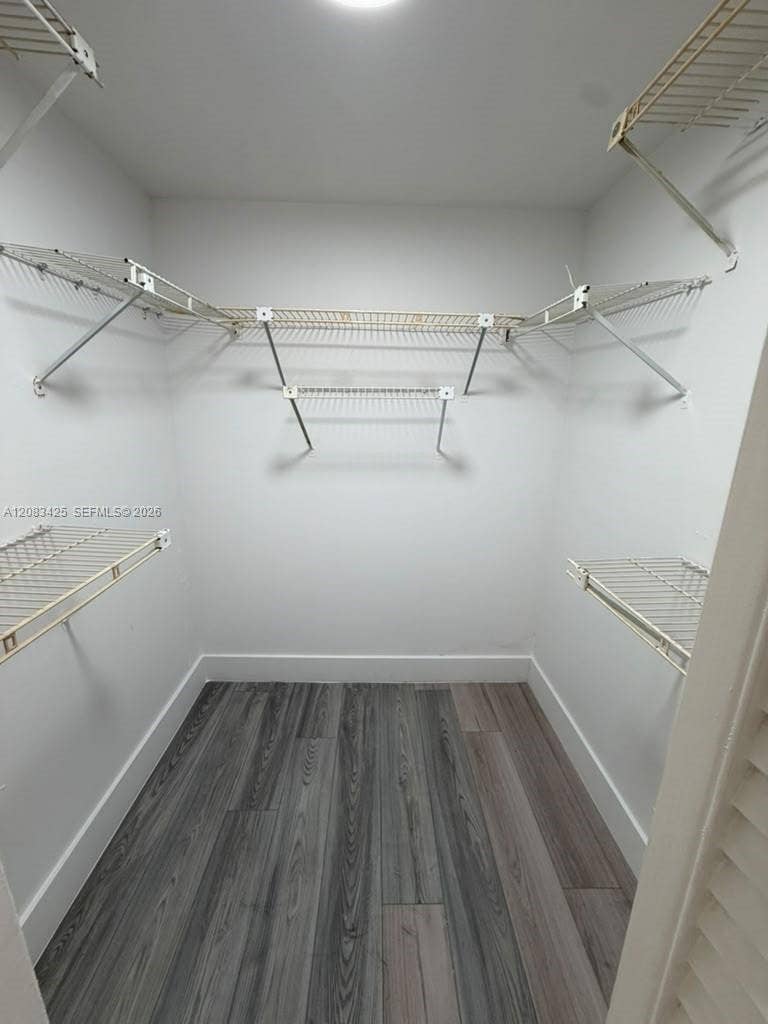 8001 Fairview Drive, #101, Tamarac, Tamarac, FL 33321 Walk-in storage space featuring wood-finish flooring and multi-level white wire shelving