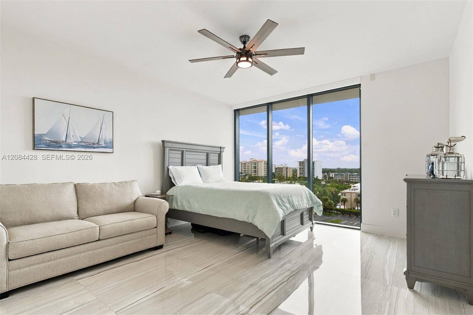 730 N Ocean Boulevard, #601, Pompano Beach, Pompano Beach, FL 33062 Spacious guest bedroom with a queen-size bed and full-size pullout sofa.