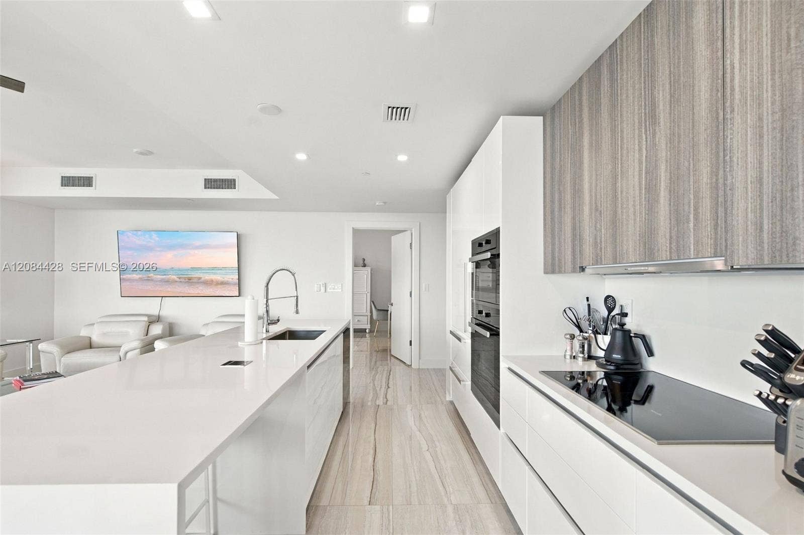 730 N Ocean Boulevard, #601, Pompano Beach, Pompano Beach, FL 33062 Sleek kitchen with extensive cabinetry, built-in appliances and separate cooktop.