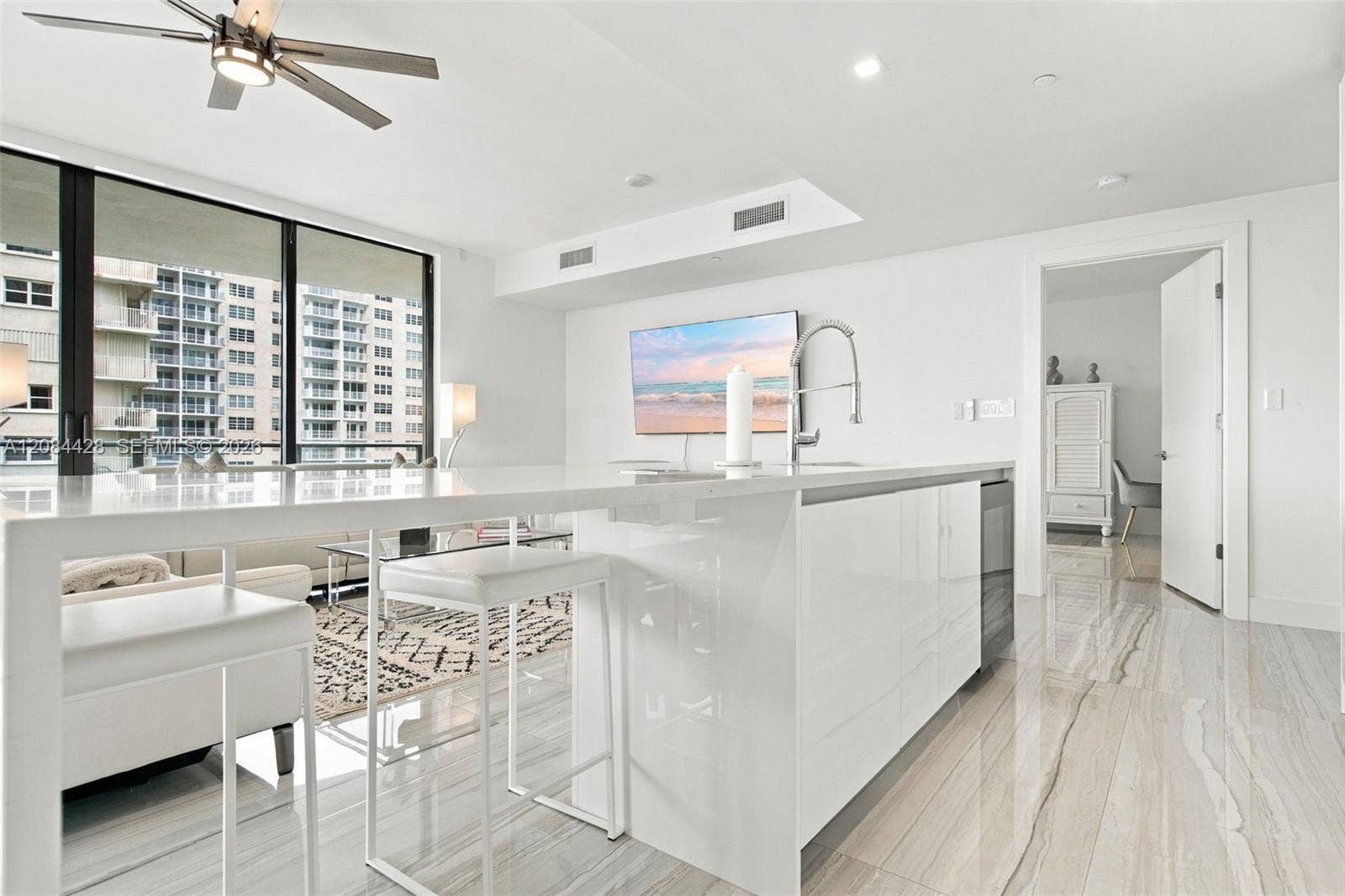 730 N Ocean Boulevard, #601, Pompano Beach, Pompano Beach, FL 33062 Oversized kitchen island with seating and generous preparation space.