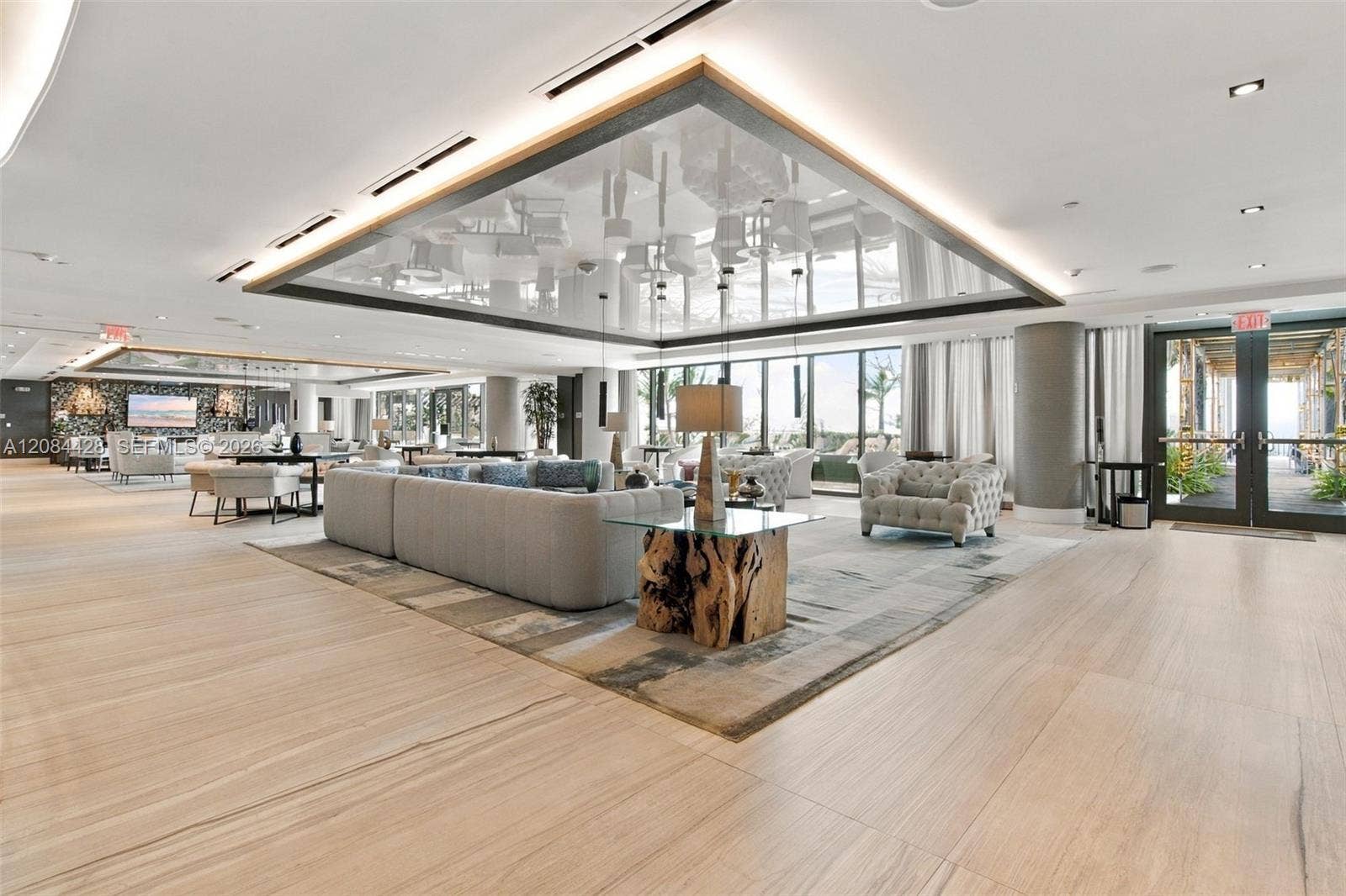 730 N Ocean Boulevard, #601, Pompano Beach, Pompano Beach, FL 33062 Sophisticated residents' lounge featuring contemporary coastal design and comfortable gathering spaces.