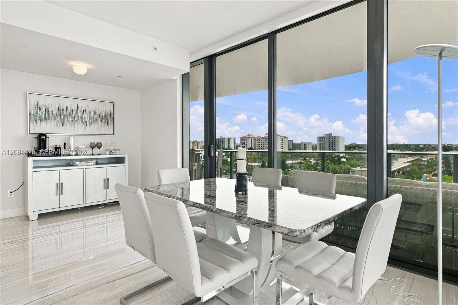 730 N Ocean Boulevard, #601, Pompano Beach, Pompano Beach, FL 33062 Dining area with floor-to-ceiling windows and direct balcony access.
