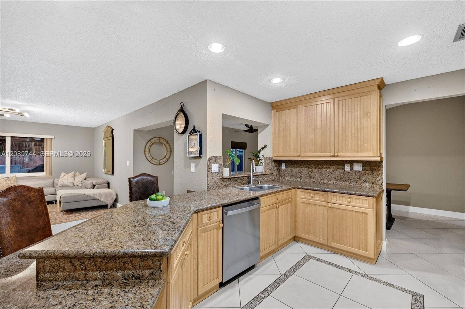 Updated kitchen w/ stainless appliances and wood cabinets, granite counters