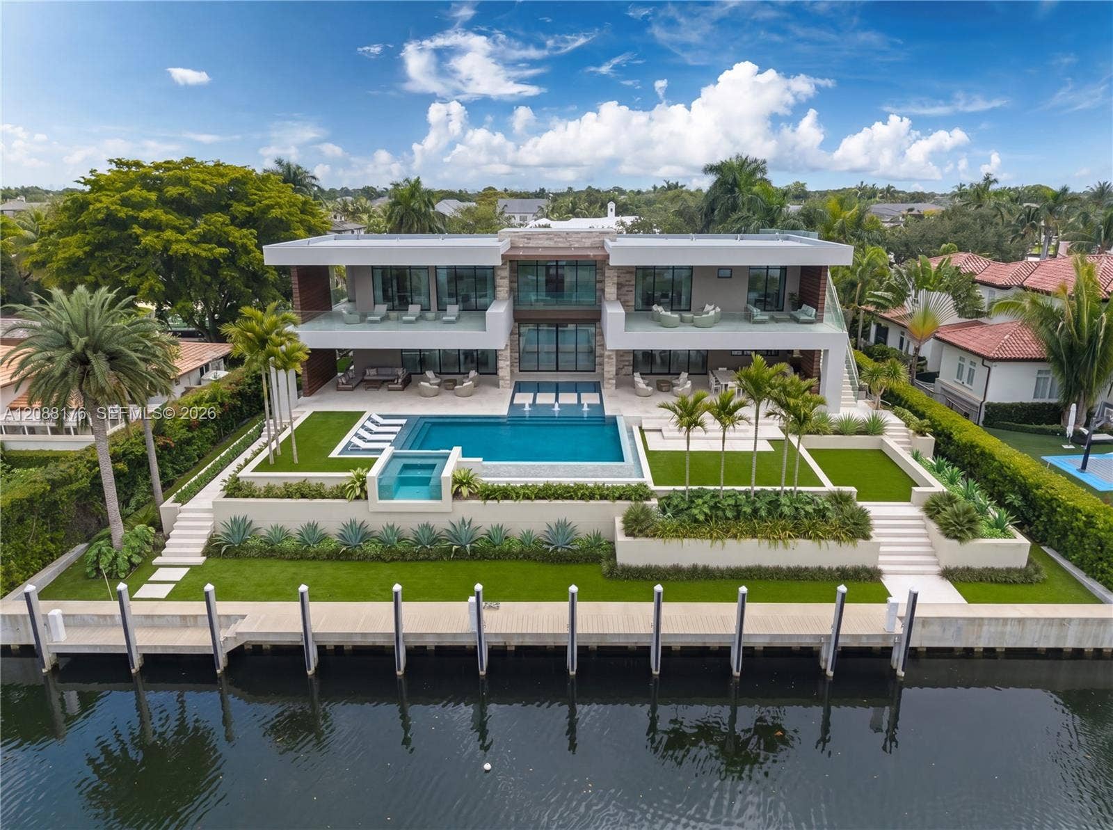 The proposed two-story estate offers approximately 7,845 square feet of air-conditioned living space  conceived around light, water and effortless indoor-outdoor living.*Virtual staging inspired by Ramon Pachecos architectural renderings for the proposed residence. The property is offered with approved, shovel-ready plans.