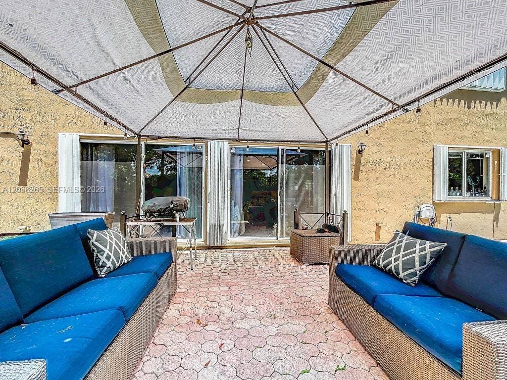 1342 NW 195th Avenue, Pembroke Pines, FL 33029 Covered pool-side area