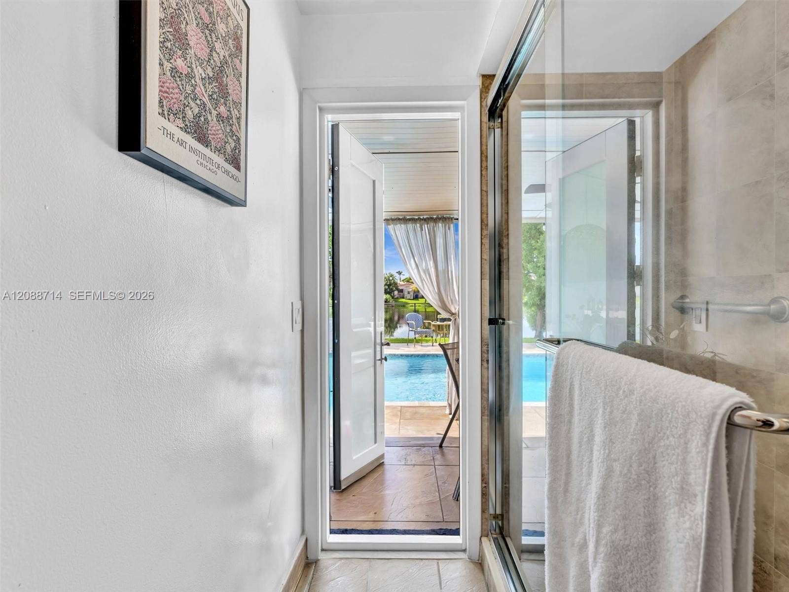 Guest bathroom with caban door to pool
