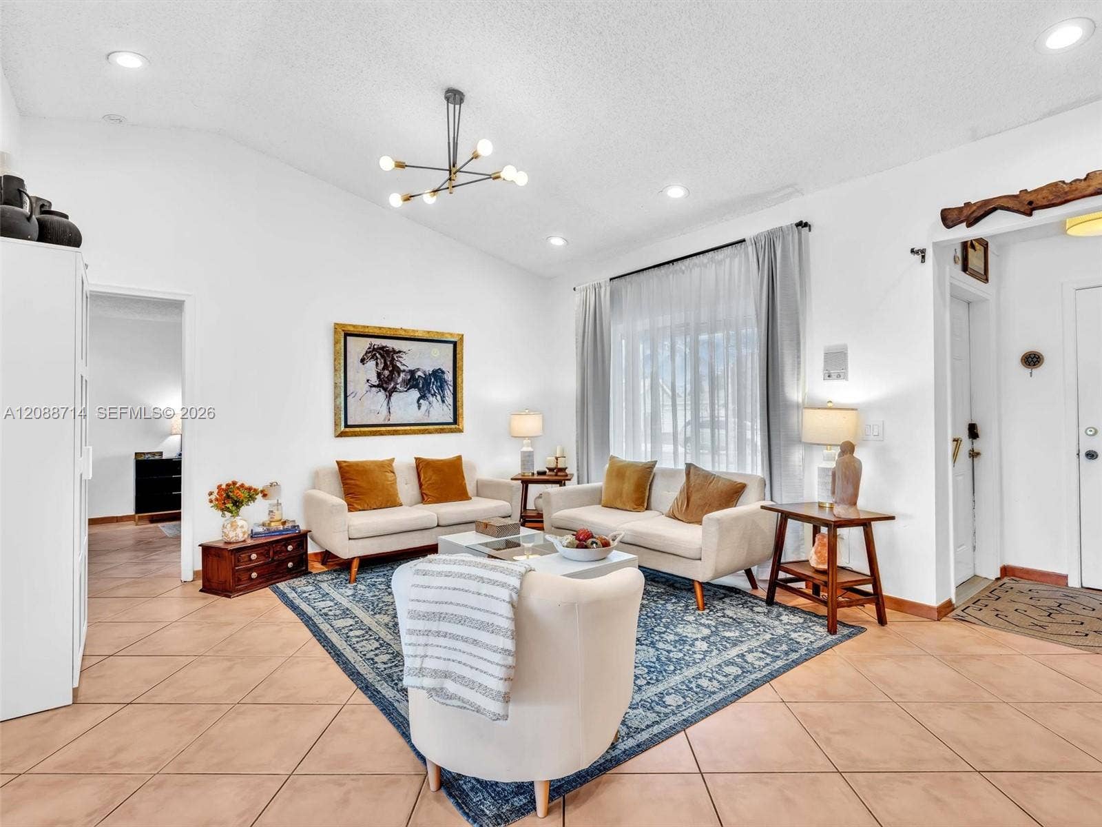 8500 NW 7th Street, Pembroke Pines, FL 33024 Living room with door to the primary bedroom