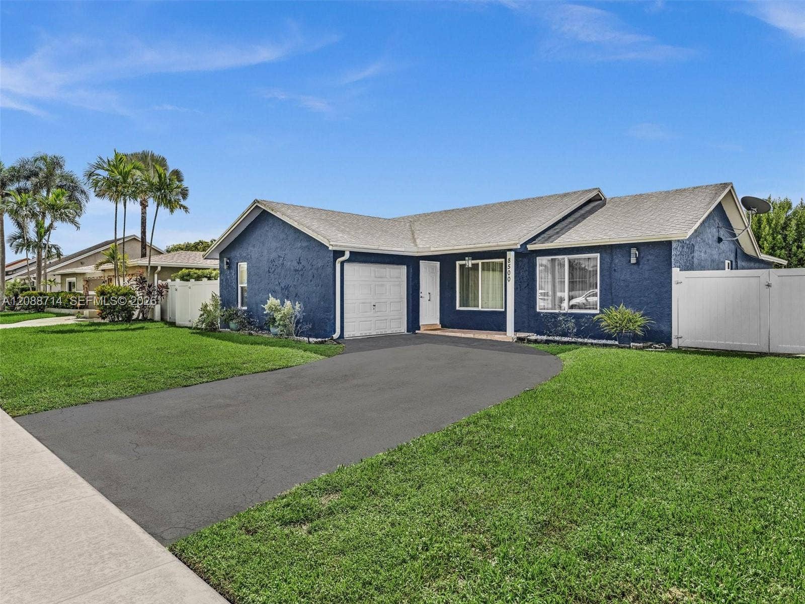 Spacious driveway accommodates multiple cars