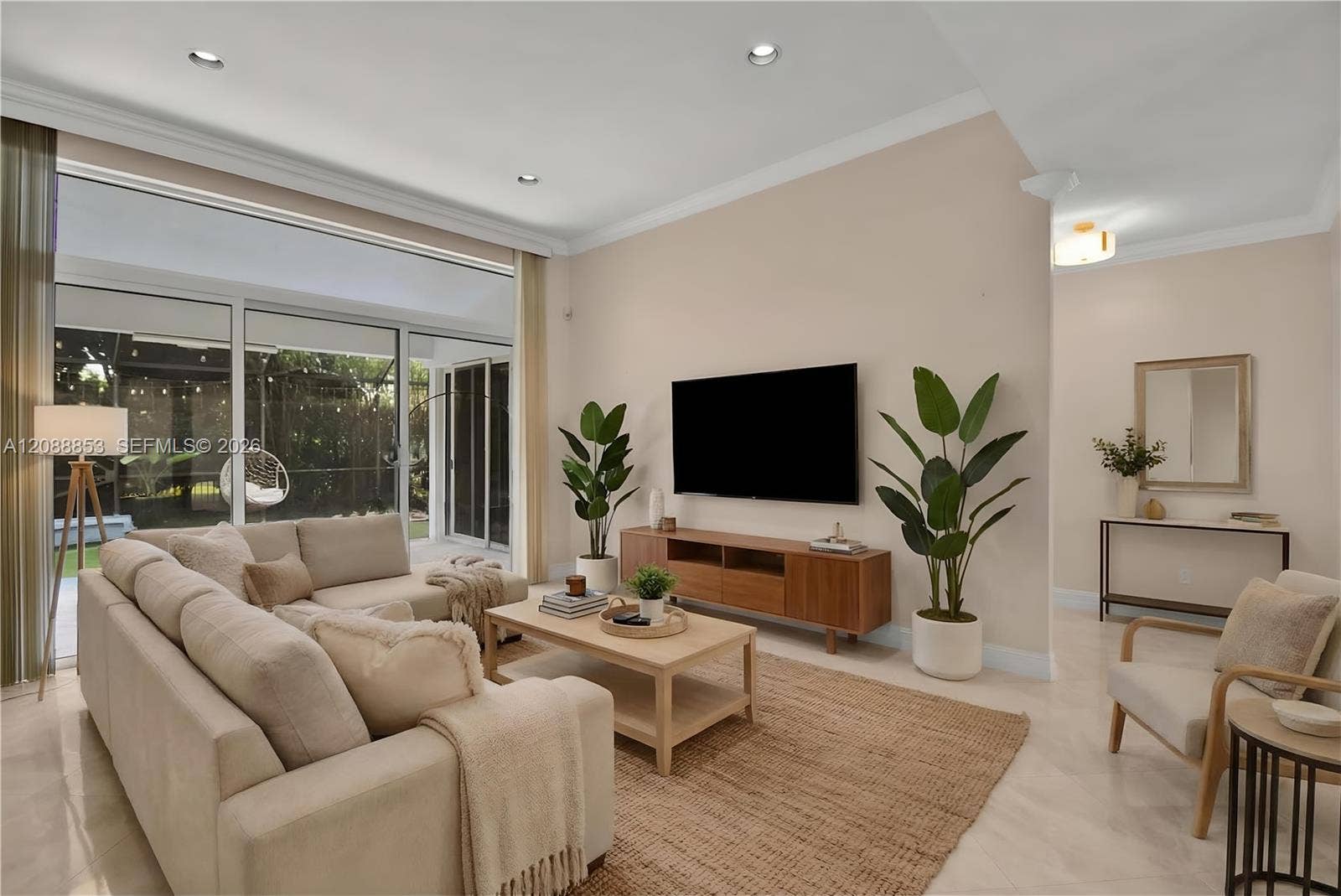 523 Stonemont Drive, Weston, FL 33326 Virtual staging. Full impact doors opening to serene patio views