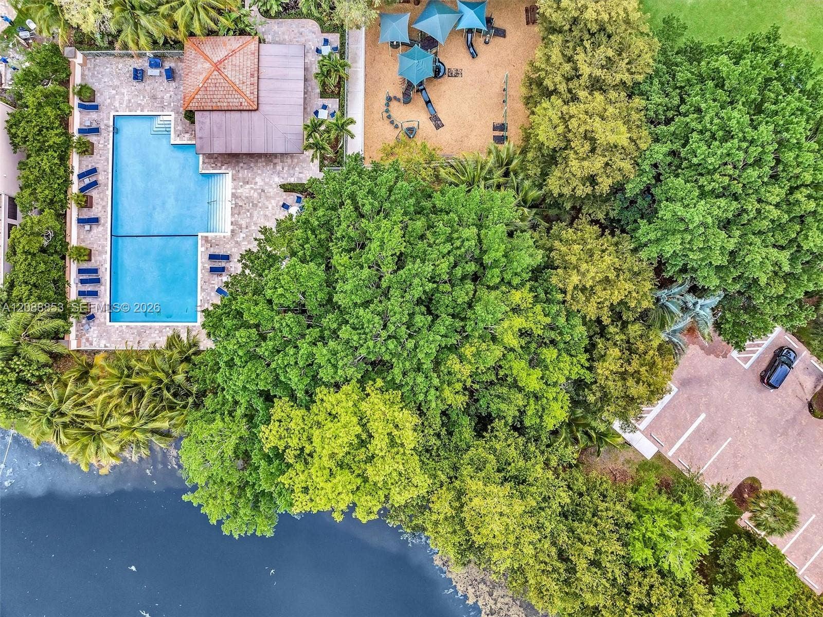 523 Stonemont Drive, Weston, FL 33326 Community amenities include a pool with lake views, childrens park, and picnic area