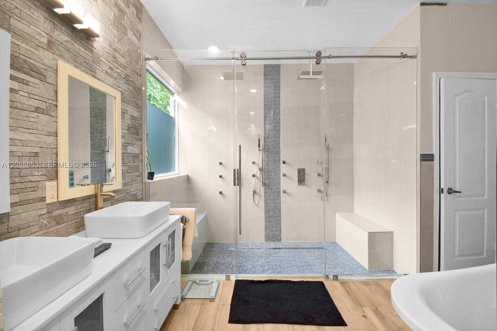 523 Stonemont Drive, Weston, FL 33326 Primary bathroom featuring dual vanities and a dual rainfall walk-in shower