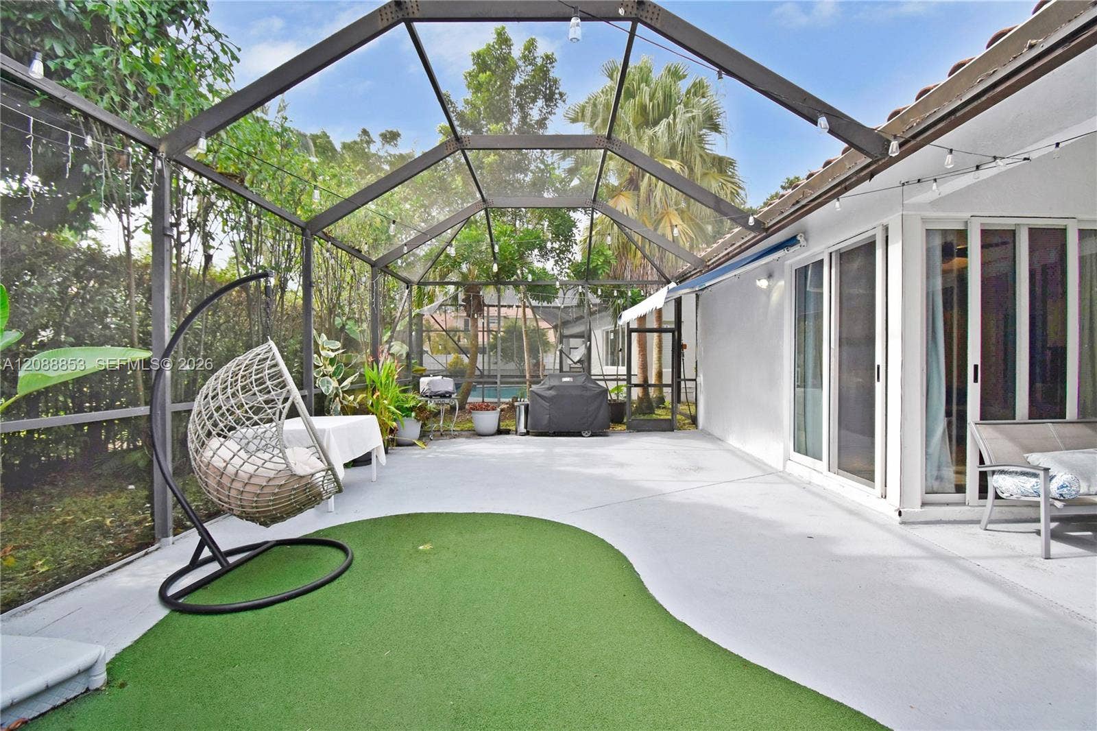 523 Stonemont Drive, Weston, FL 33326 Screened patio offering flexible indoor-outdoor living with potential to expand