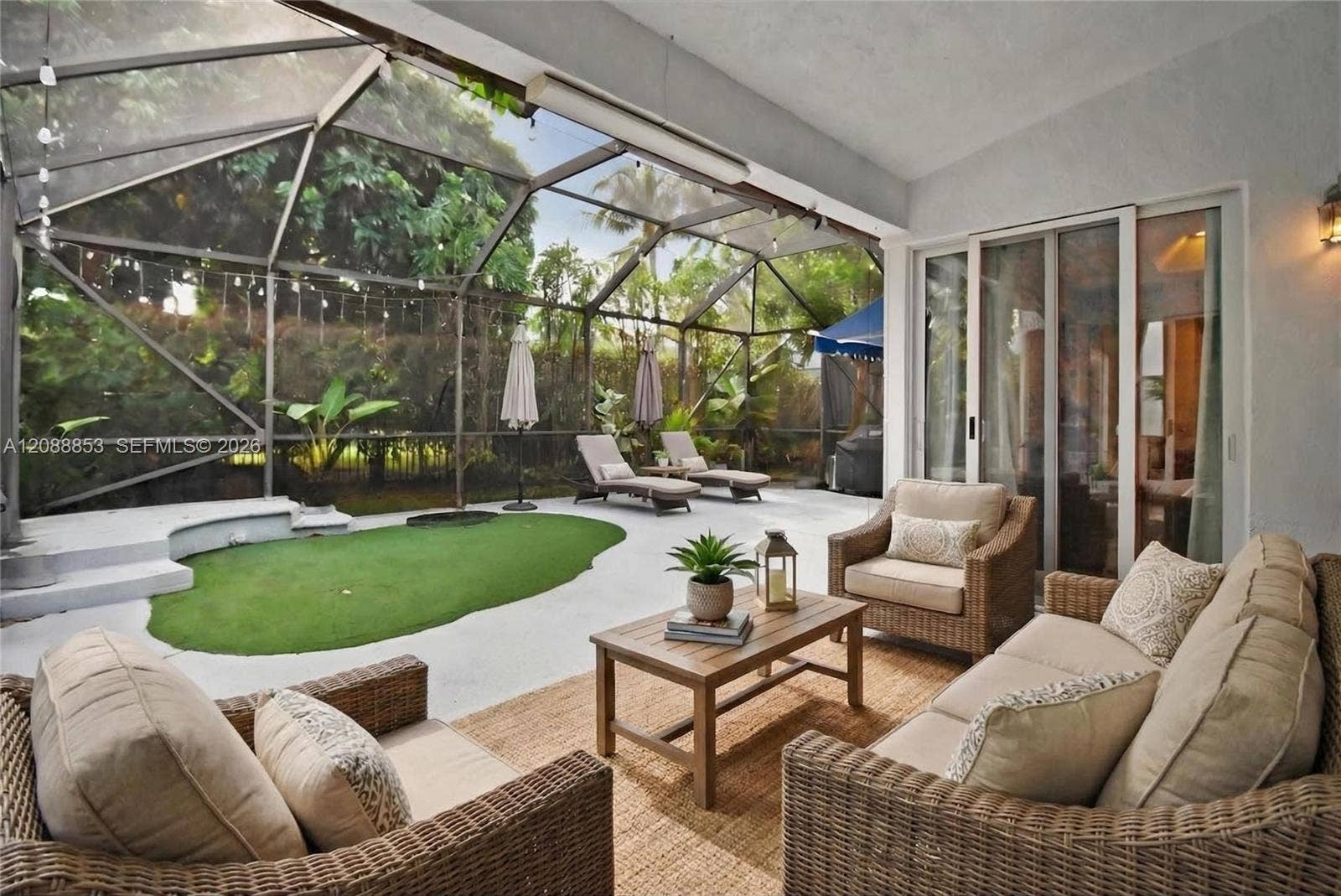 523 Stonemont Drive, Weston, FL 33326 Virtual staging. Covered sitting area within screened patio enclosure
