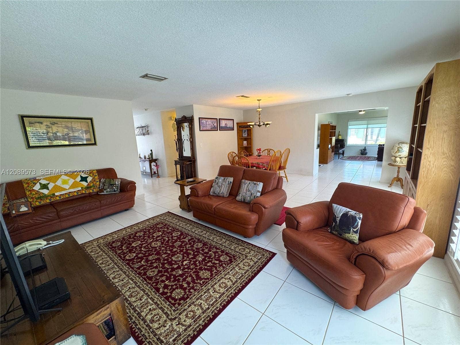 Long view from Living Room, past dining room, and view to den/family room.