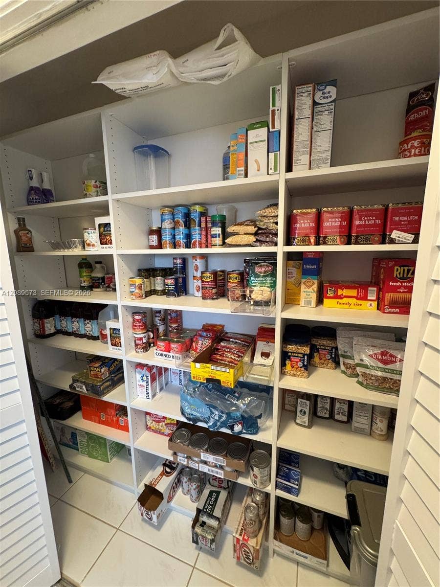 Hall closet can be used for additional storage or linens.