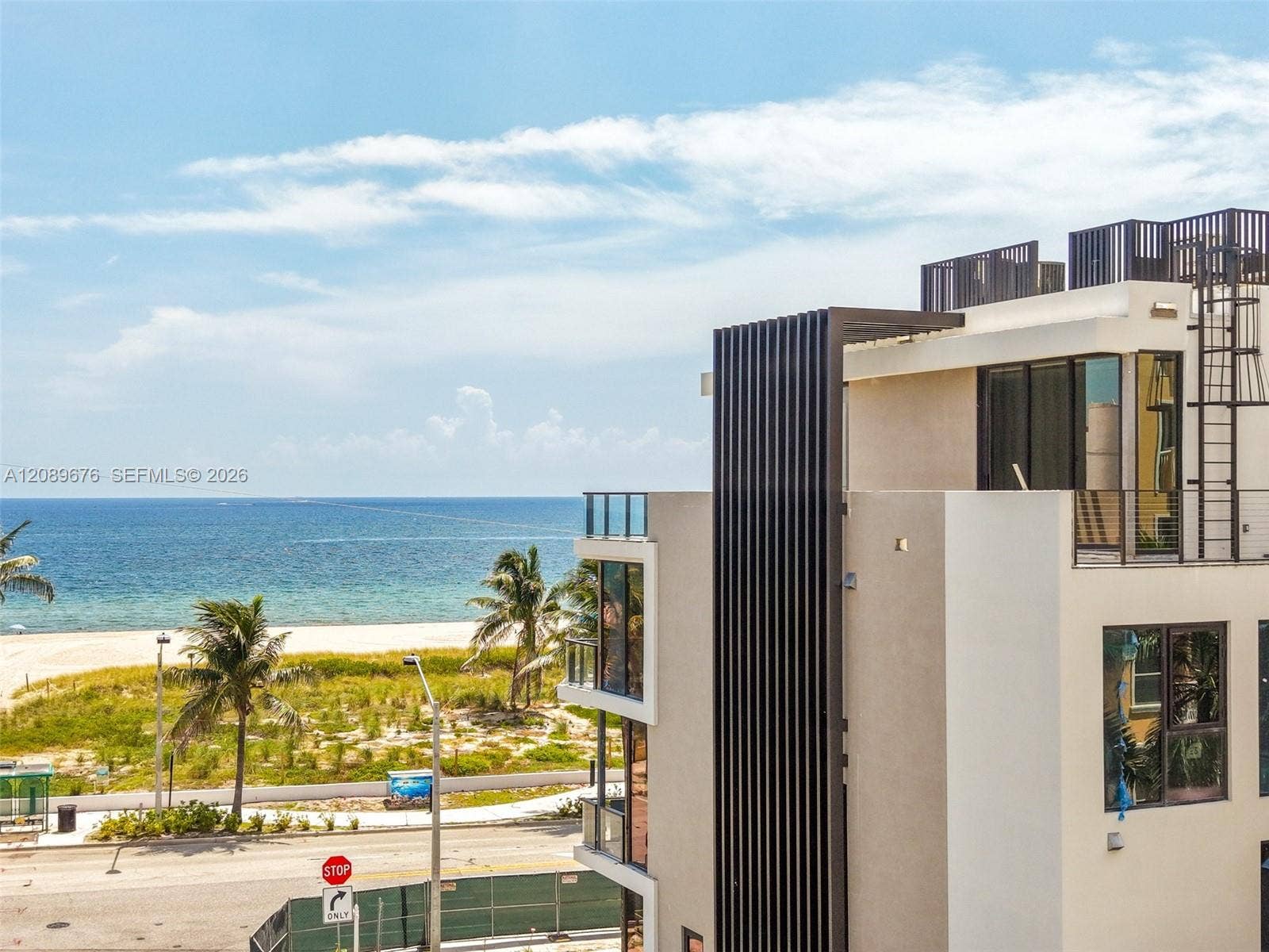 497 N Ocean Boulevard, #1, Pompano Beach, FL 33062 Facade detail, ocean beyond.