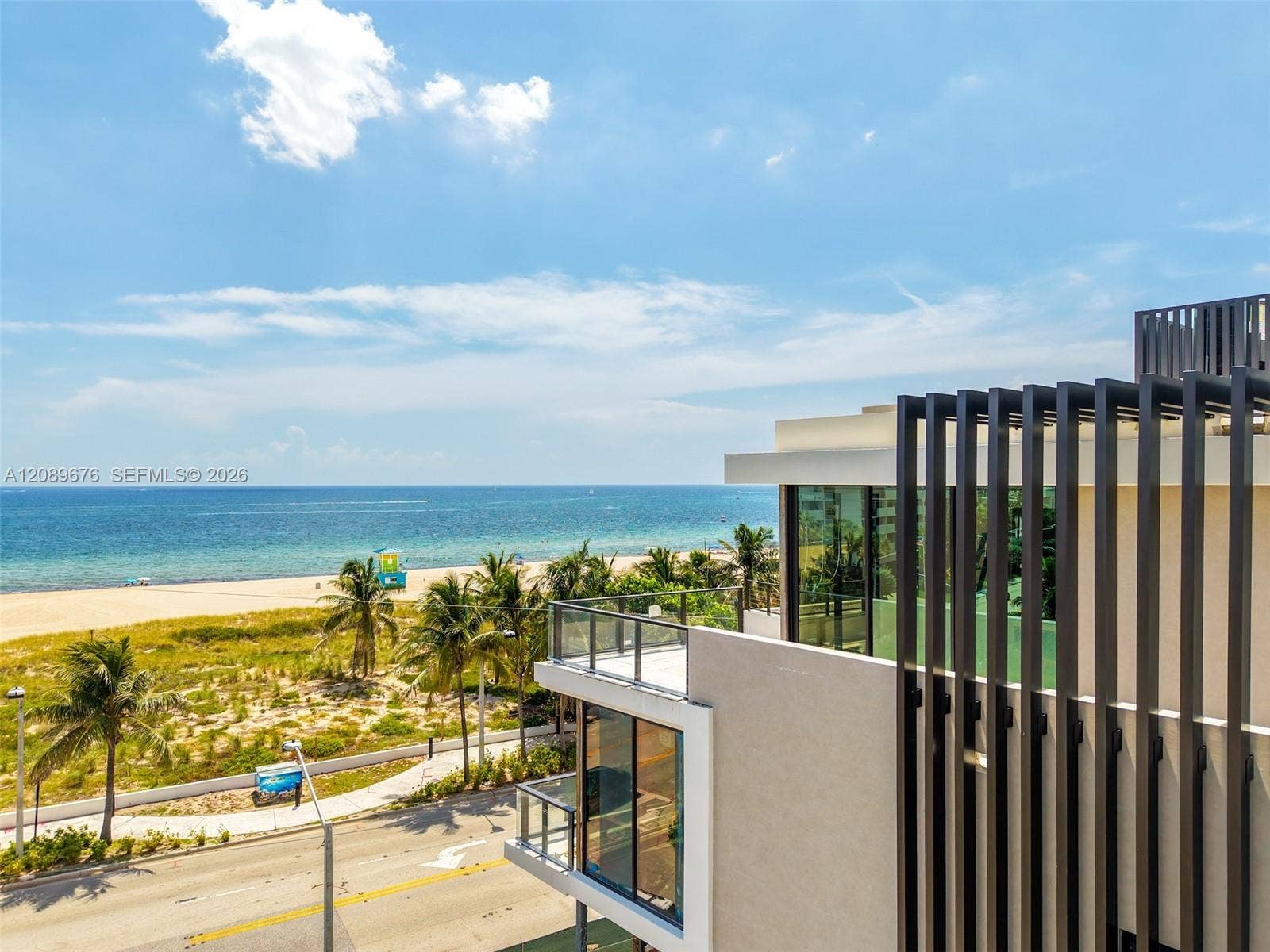 497 N Ocean Boulevard, #1, Pompano Beach, FL 33062 Louvered facade with the beach beyond.