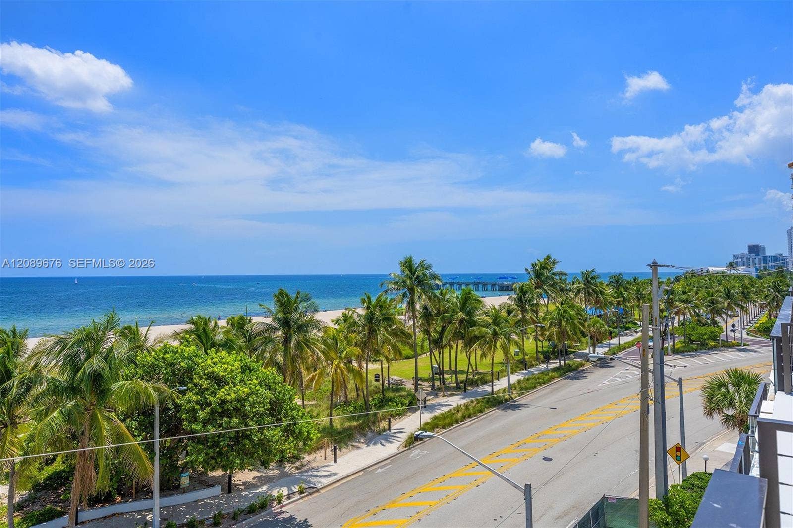 497 N Ocean Boulevard, #1, Pompano Beach, FL 33062 View south along the beach to the Pompano Beach pier.