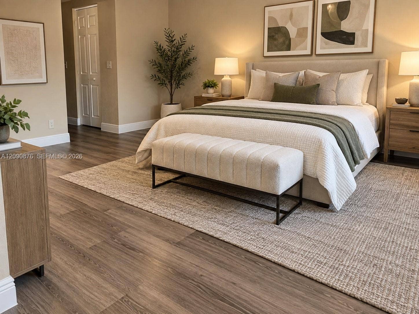 2196 Ensenada Terrace, Weston, FL 33327 Wood-finish flooring throughout, featuring a neutral color palette and a prominent upholstered bed frame