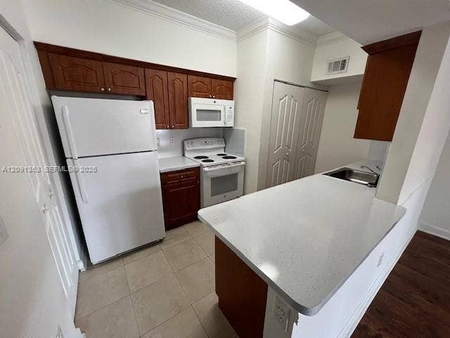 18356 NW 68th Avenue, #E, Hialeah, Hialeah, FL 33015 Kitchen featuring wood cabinetry, white appliances, solid surface countertops, and tile flooring