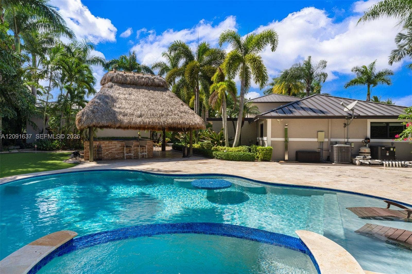 14800 SW 166th Street, Miami, FL 33187 Entertainment pool with spa and additional seating