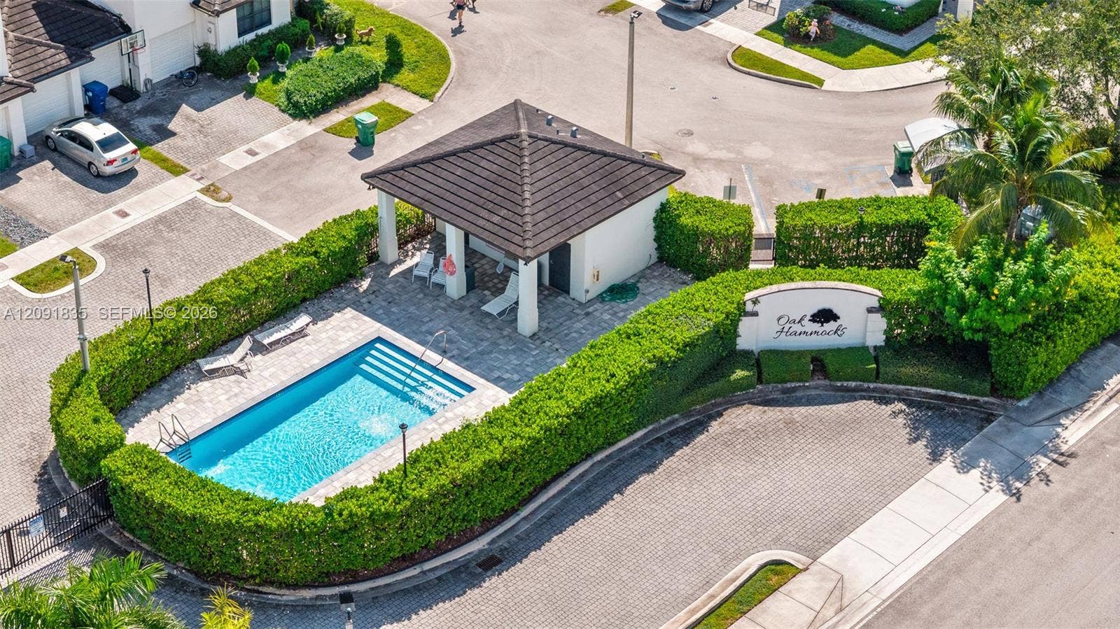 22409 SW 102nd Avenue, Miami, FL 33190 Community amenities including a swimming pool, paved sundeck, covered pavilion, and privacy hedges