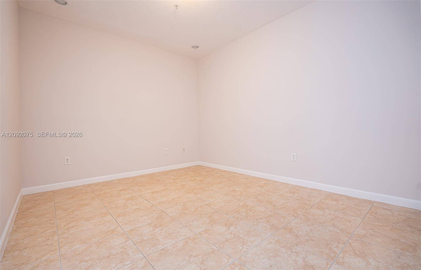 3055 NW 126th Avenue, #219, Sunrise, FL 33323 Recessed lighting, neutral wall tones, and tiled flooring