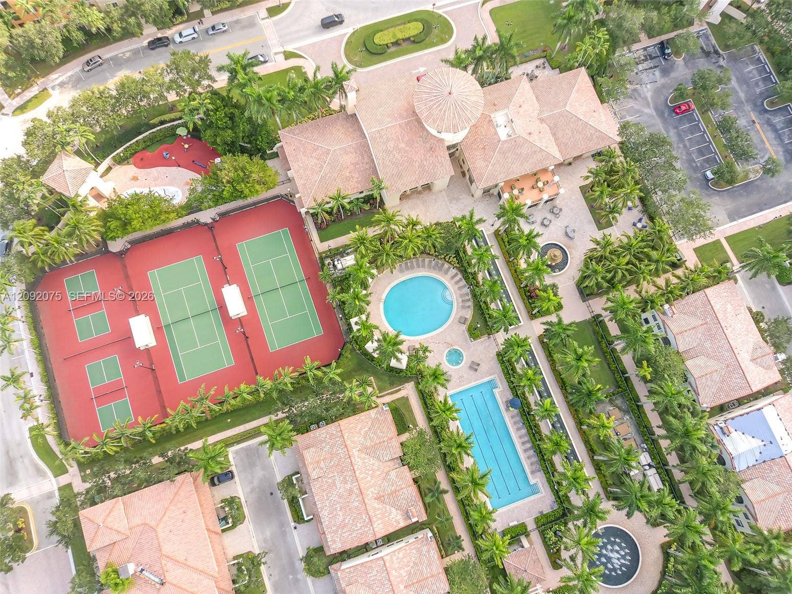 3055 NW 126th Avenue, #219, Sunrise, FL 33323 Community featuring two tennis courts, two swimming pools, a central fountain, and extensive landscaping