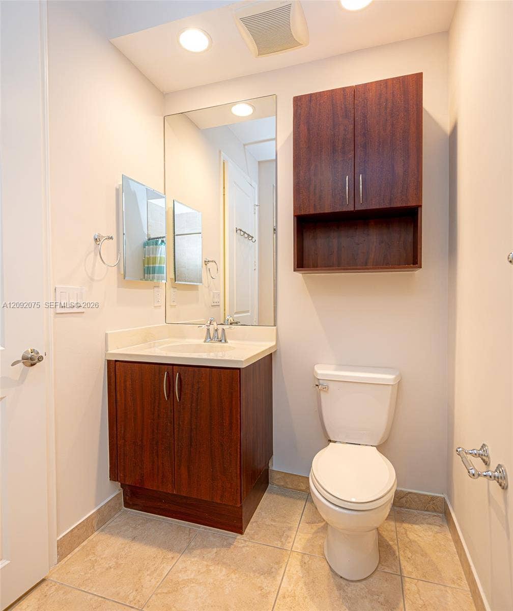 3055 NW 126th Avenue, #219, Sunrise, FL 33323 Wood-finish vanity with an integrated sink and countertop