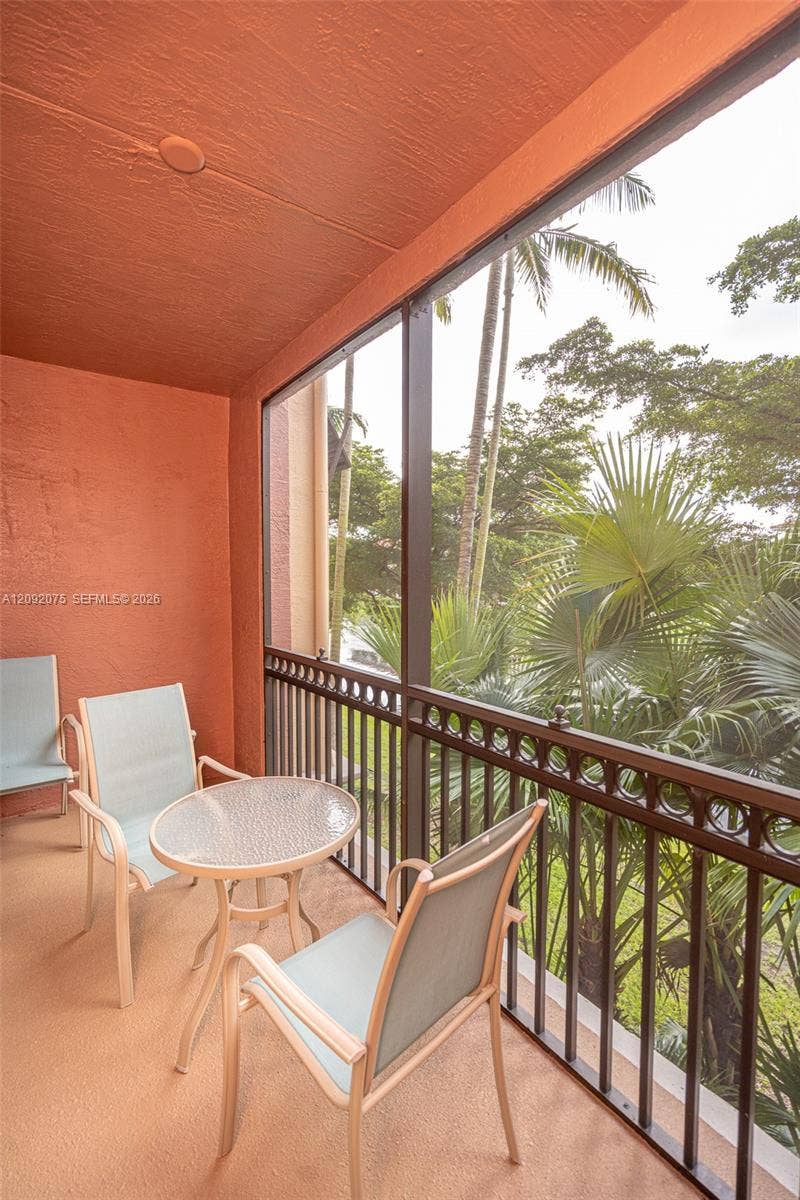 3055 NW 126th Avenue, #219, Sunrise, FL 33323 Screened balcony with textured orange walls and ceiling