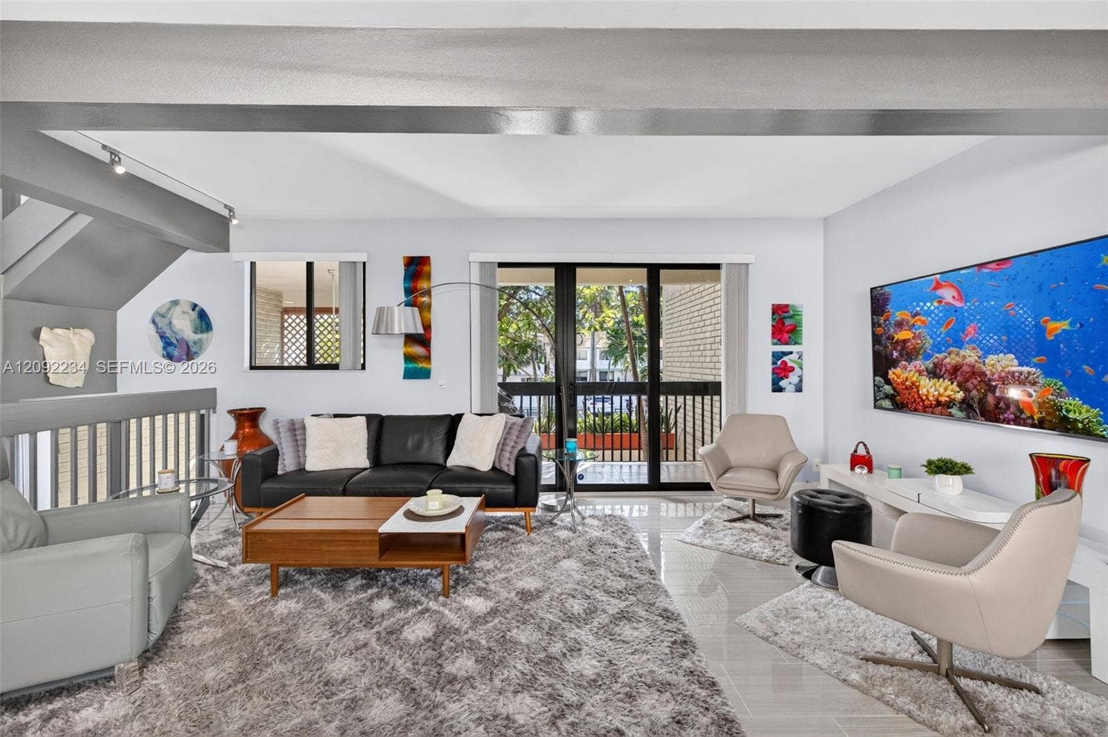 1401 NE 9th Street, #50, Fort Lauderdale, FL 33304 Impact Sliding doors in the Living Room Adds to the Open Floor Plan Feeling