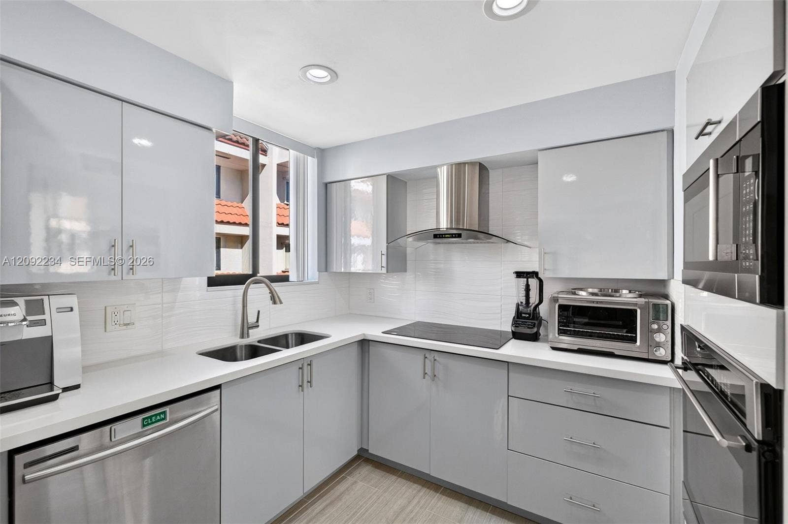1401 NE 9th Street, #50, Fort Lauderdale, FL 33304 Sleek Gloss Gray Cabinetry Befits this Elegant Townhouse