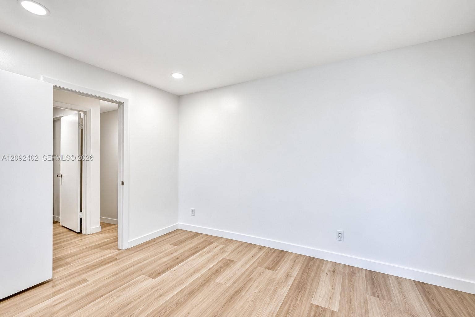 499 SE 13th Street, #7E, Fort Lauderdale, FL 33316 Interior space featuring wood-finish flooring, crisp white walls, and recessed ceiling lighting